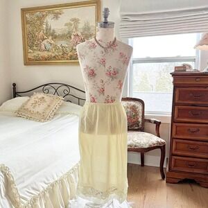 yellow lace slip skirt  70s yellow lace slip skirt fits like a small